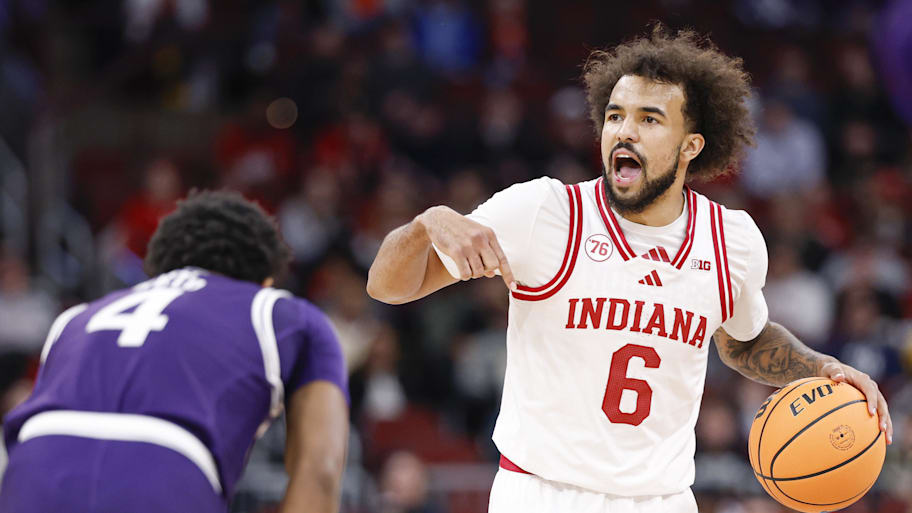 Indiana guard Tayton Conerway brings the ball up court against Northwestern guard Jayden Reid.