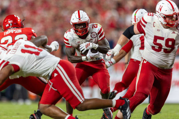 Nebraska's Cam Lenhardt (11) blocks for Emmett Johnson during the second quarter against Cincinnati on Aug 28, 2025.