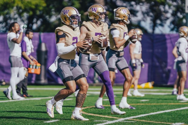 Demond Williams Jr., left, and Will Rogers will handle the UW quarterbacking chores this season. 