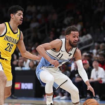 Mar 8, 2025; Atlanta, Georgia, USA; Atlanta Hawks guard Trae Young (11) dribbles against Indiana Pacers guard Ben Sheppard (26) during the first quarter at State Farm Arena. Mandatory Credit: Mady Mertens-Imagn Images