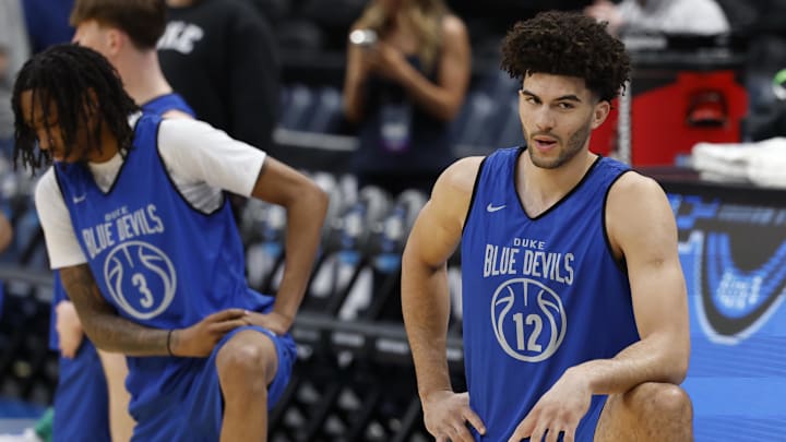 Mar 26, 2026; Washington, DC, USA; Duke Blue Devils forward Cameron Boozer (12) kneels alongside Blue Devils guard Isaiah Evans (3) during a practice session ahead of the east regional of the men's 2026 NCAA Tournament at Capital One Arena.