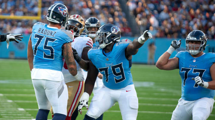 The Tennessee Titans offensive line celebrates after San Francisco 49ers defensive tackle Javon Hargrave (98) jumped offsides during their first preseason game of the 2024-25 season at Nissan Stadium Saturday, Aug. 10, 2024.