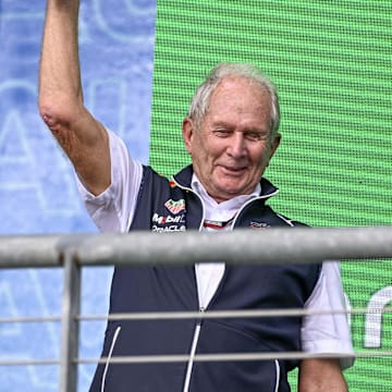 Oct 23, 2022; Austin, Texas, USA; Helmut Marko of Red Bull Racing Team holds up the World Constructors' Champions trophy after the running of the U.S. Grand Prix F1 race at Circuit of the Americas. Mandatory Credit: Jerome Miron-Imagn Images