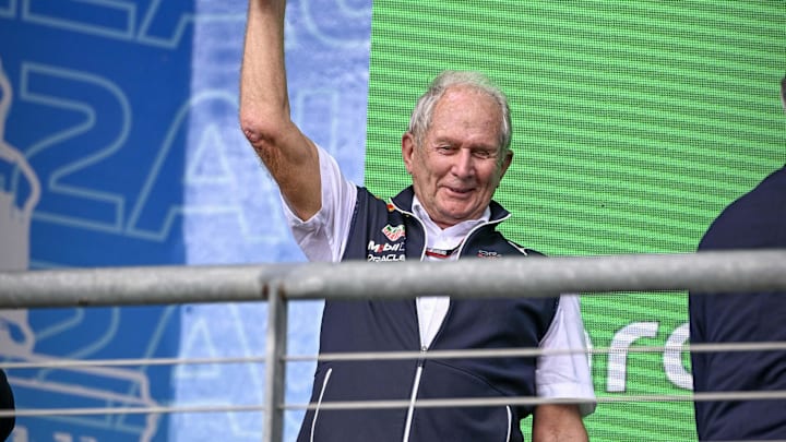 Oct 23, 2022; Austin, Texas, USA; Helmut Marko of Red Bull Racing Team holds up the World Constructors' Champions trophy after the running of the U.S. Grand Prix F1 race at Circuit of the Americas. Mandatory Credit: Jerome Miron-Imagn Images