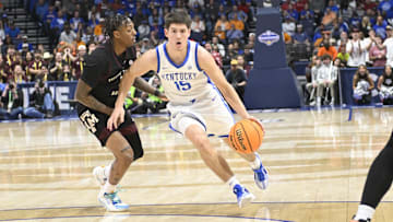 Kentucky Wildcats guard Reed Sheppard drives down the lane against the Texas A&M Aggies during the second half at Bridgestone Arena. 