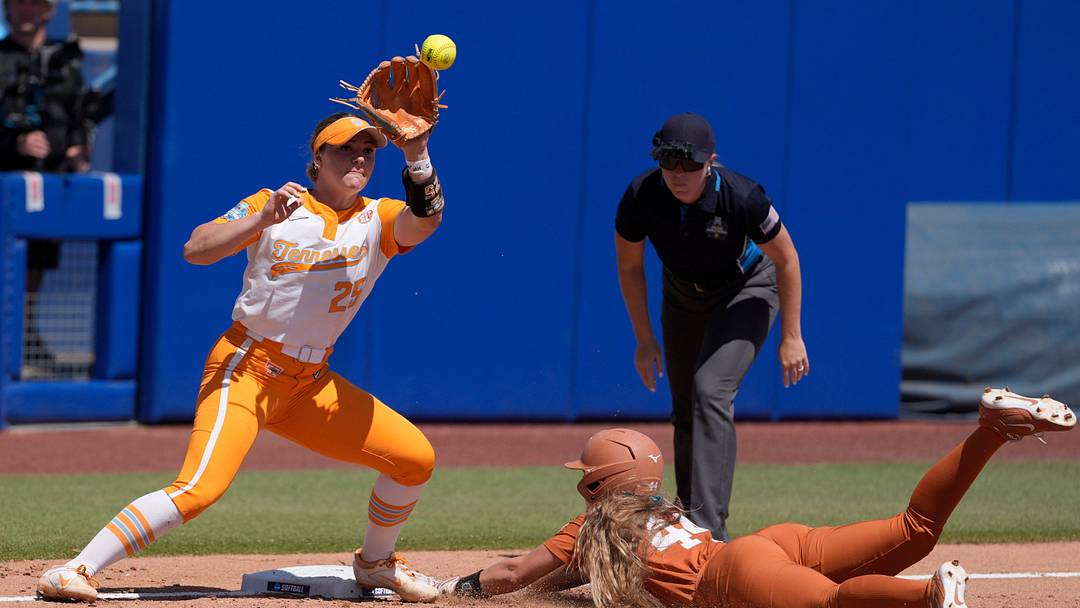 Texas Longhorns utility Kaiah Altmeyer (44) slides to third base as Tennessee Lady Volunteers infielder Ella Dodge (25) waits for the ball in the third inning of a Women's College World Series softball game between the University of Texas Longhorns and the Tennessee Lady Volunteers at Devon Park in Oklahoma City, Monday, June 1, 2026.