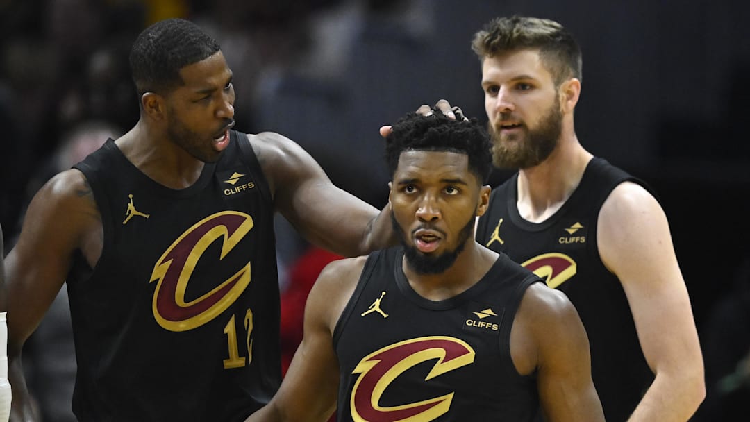 Oct 31, 2023; Cleveland, Ohio, USA; Cleveland Cavaliers center Tristan Thompson (12), guard Donovan Mitchell (45) and forward Dean Wade (32) celebrate in the second quarter against the New York Knicks at Rocket Mortgage FieldHouse. Mandatory Credit: David Richard-Imagn Images Oct 31, 2023; Cleveland, Ohio, USA; Cleveland Cavaliers center Tristan Thompson (12), guard Donovan Mitchell (45) and forward Dean Wade (32) celebrate in the second quarter against the New York Knicks at Rocket Mortgage FieldHouse. Mandatory Credit: David Richard-Imagn Images