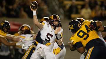 Sep 13, 2025; Berkeley, California, USA; Minnesota Golden Gophers quarterback Drake Lindsey (5) is pressured by the California Golden Bears defense during the first quarter at California Memorial Stadium. Mandatory Credit: D. Ross Cameron-Imagn Images