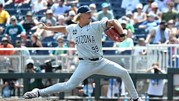 Jun 13, 2025; Omaha, Neb, USA; Arizona Wildcats pitcher Garrett Hicks (99) throws against the Coastal Carolina Chanticleers during the seventh inning at Charles Schwab Field. Mandatory Credit: Steven Branscombe-Imagn Images