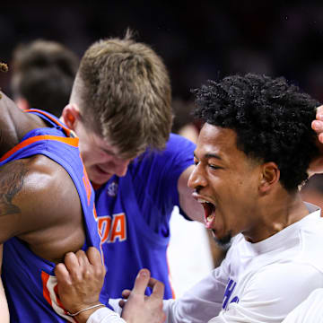 Denzel Aberdeen celebrates with teammates as the Florida Gators clinched the national championship.