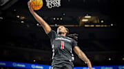 Mar 12, 2025; Kansas City, MO, USA; Cincinnati Bearcats guard Day Day Thomas (1) shoots the ball during the second half against the Cincinnati Bearcats at T-Mobile Center. Mandatory Credit: William Purnell-Imagn Images