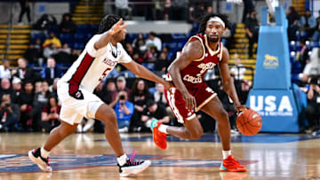 Chase Forte dribbles around a UMass player at MassMutual Center on Dec. 10, 2025.