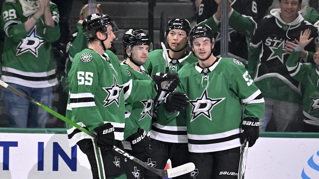 Feb 25, 2026; Dallas, Texas, USA;  Dallas Stars defenseman Thomas Harley (55) and center Mavrik Bourque (22) and left wing Jason Robertson (21) center Wyatt Johnston (53) celebrates a goal scored by Johnston against the Seattle Kraken during the first period at the American Airlines Center. Mandatory Credit: Jerome Miron-Imagn Images