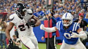 Houston Texans running back Nick Chubb (21) rushes past Indianapolis Colts safety Camryn Bynum (0) for a touchdown Sunday, Nov. 30, 2025, during a game at Lucas Oil Stadium in Indianapolis.