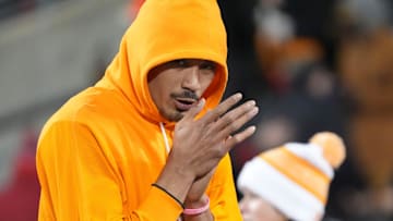 Tennessee quarterback Nico Iamaleava (8) tries to keep warm before the start of the NCAA college football playoff game against Ohio State on Saturday, Dec. 21, 2024, in Columbus, Ohio.