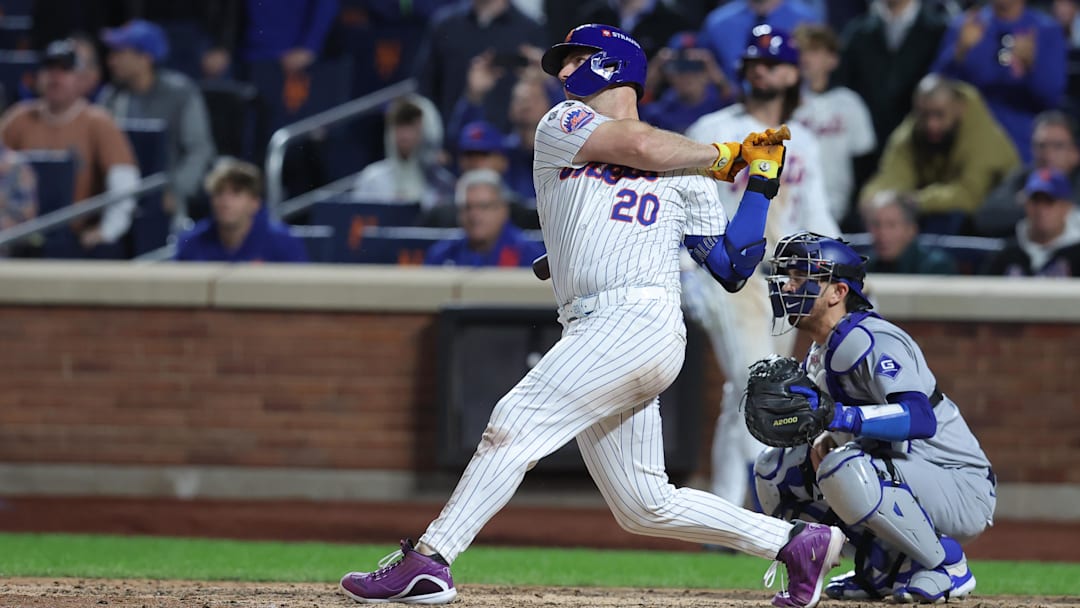 Oct 18, 2024; New York City, New York, USA; New York Mets first base Pete Alonso (20) hits a single in the eighth inning against the Los Angeles Dodgers during game five of the NLCS for the 2024 MLB playoffs at Citi Field. Mandatory Credit: Brad Penner-Imagn Images