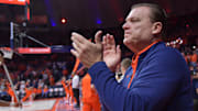 Nov 13, 2024; Champaign, Illinois, USA;  Illinois Fighting Illini head coach Brad Underwood applauds the crowd before a against the Oakland Golden Grizzlies at State Farm Center. Mandatory Credit: Ron Johnson-Imagn Images