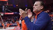 Nov 13, 2024; Champaign, Illinois, USA;  Illinois Fighting Illini head coach Brad Underwood applauds the crowd before a against the Oakland Golden Grizzlies at State Farm Center. Mandatory Credit: Ron Johnson-Imagn Images