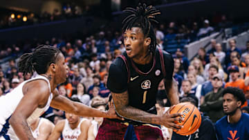 Mar 4, 2025; Charlottesville, Virginia, USA; Florida State Seminoles guard Jamir Watkins (1) controls the ball while Virginia Cavaliers guard Dai Dai Ames (7) defends in the first half at John Paul Jones Arena. Mandatory Credit: Emily Faith Morgan-Imagn Images