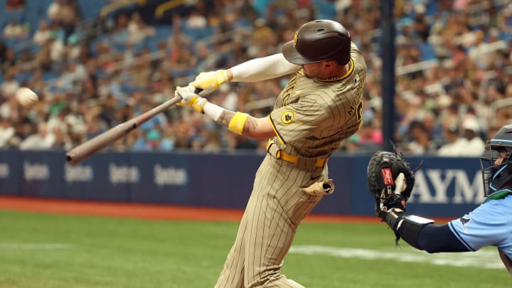 Sep 1, 2024; St. Petersburg, Florida, USA;  San Diego Padres outfielder Jackson Merrill (3) hits a 2-run home run against the Tampa Bay Rays during the fourth inning at Tropicana Field. Mandatory Credit: Kim Klement Neitzel-USA TODAY Sports