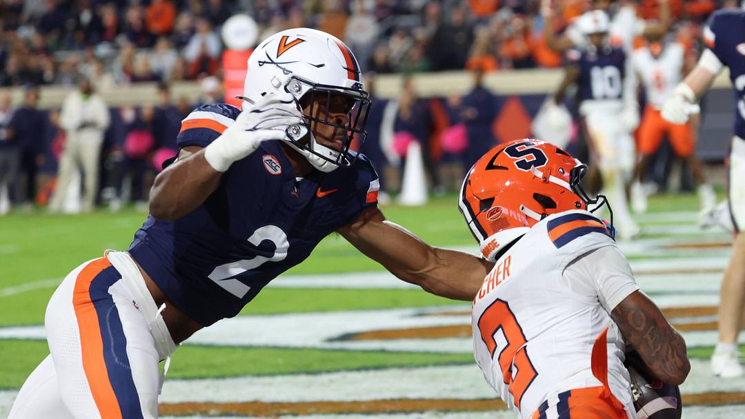 Oct 10, 2026; Charlottesville, Virginia, USA; Syracuse Orange wide receiver Umari Hatcher (2) catches a touchdown pass as Virginia Cavaliers defensive back Donavon Platt (2) defends during the first half at Scott Stadium. Mandatory Credit: Geoff Burke-Imagn Images