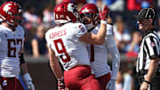 Oct 11, 2025; Oxford, Mississippi, USA; Washington State Cougars running back Kirby Vorhees (9) and wide reciever Tony Freeman (0) react after a touchdown during the third quarter against the Mississippi Rebels at Vaught-Hemingway Stadium. Mandatory Credit: Petre Thomas-Imagn Images