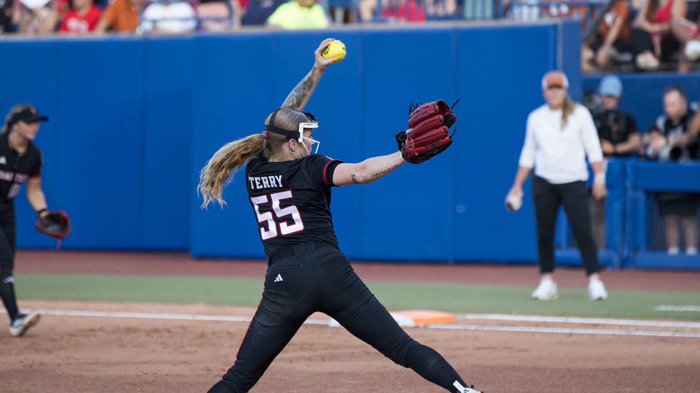 Jun 3, 2026; Oklahoma City, OK, USA; Texas Tech Red Raiders pitcher Kaitlyn Terry (55) throws a pitch in the first inning against the Texas Longhorns during Game One of the NCAA Women’s College World Series championship series at Devon Park. Mandatory Credit: Brett Rojo-Imagn Images | Brett Rojo-Ima