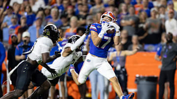 Oct 5, 2024; Gainesville, Florida, USA; Florida Gators wide receiver Chimere Dike (17) makes a catch over UCF Knights defensive back Antione Jackson (7) during the first half at Ben Hill Griffin Stadium. Mandatory Credit: Matt Pendleton-Imagn Images