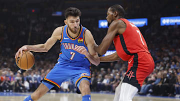 Oct 21, 2025; Oklahoma City, Oklahoma, USA; Oklahoma City Thunder center Chet Holmgren (7) drives to the basket against Houston Rockets forward Kevin Durant (7) during the first half at Paycom Center. Mandatory Credit: Alonzo Adams-Imagn Images