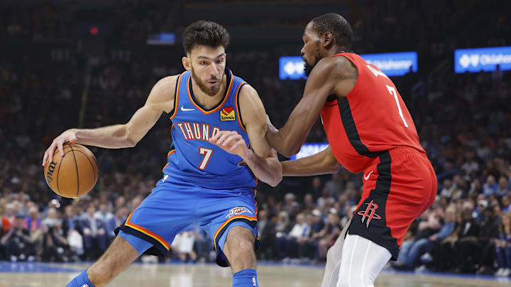 Oct 21, 2025; Oklahoma City, Oklahoma, USA; Oklahoma City Thunder center Chet Holmgren (7) drives to the basket against Houston Rockets forward Kevin Durant (7) during the first half at Paycom Center. Mandatory Credit: Alonzo Adams-Imagn Images
