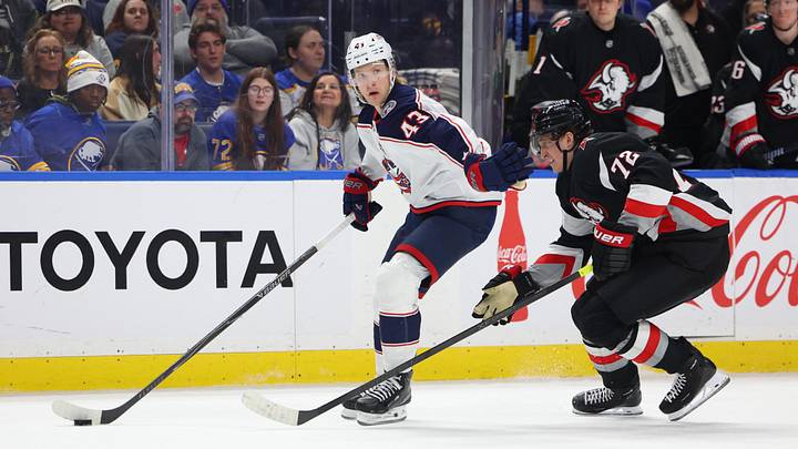 Apr 9, 2026; Buffalo, New York, USA;  Columbus Blue Jackets left wing Danton Heinen (43) skates with the puck as Buffalo Sabres center Tage Thompson (72) tries to defend during the first period at KeyBank Center. Mandatory Credit: Timothy T. Ludwig-Imagn Images