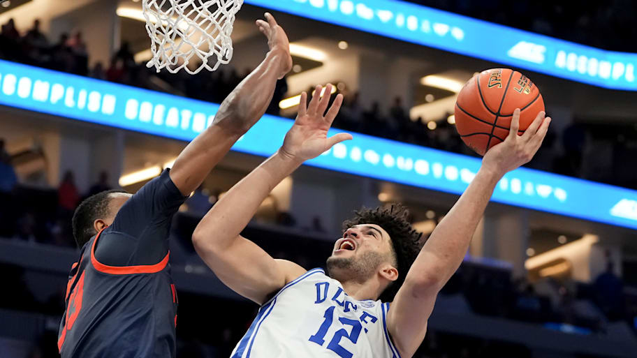 Duke forward Cameron Boozer goes to the basket against Virginia center Ugonna Onyenso.