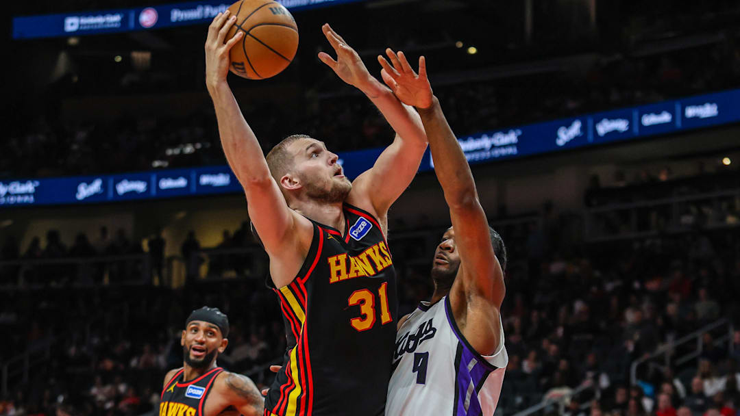 Mar 28, 2026; Atlanta, Georgia, USA; Atlanta Hawks center Jock Landale (31) shoots the ball against Sacramento Kings forward Precious Achiuwa (9) during the third quarter at State Farm Arena. Mandatory Credit: Jordan Godfree-Imagn Images