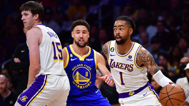 May 6, 2023; Los Angeles, California, USA; Los Angeles Lakers guard D'Angelo Russell (1) moves the ball as guard Austin Reaves (15) provides coverage against Golden State Warriors guard Klay Thompson (11) during the first half in game three of the 2023 NBA playoffs at Crypto.com Arena. Mandatory Credit: Gary A. Vasquez-USA TODAY Sports