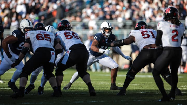 Penn State's Abdul Carter (11) rushes the passer against Rutgers. 