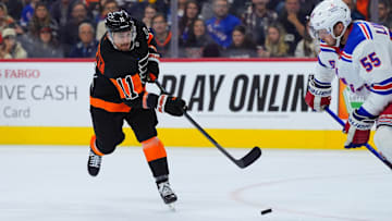 Nov 29, 2024; Philadelphia, Pennsylvania, USA; Philadelphia Flyers right wing Travis Konecny (11) shoots the puck against the New York Rangers in the third period at Wells Fargo Center. Mandatory Credit: Kyle Ross-Imagn Images