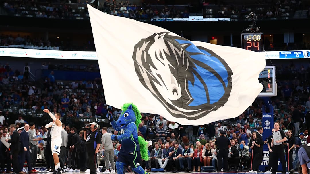 Mar 6, 2020; Dallas, Texas, USA;  Dallas Mavericks mascot Champ waves the team flag prior to the game against the Memphis Grizzlies at the American Airlines Center. Mandatory Credit: Matthew Emmons-Imagn Images