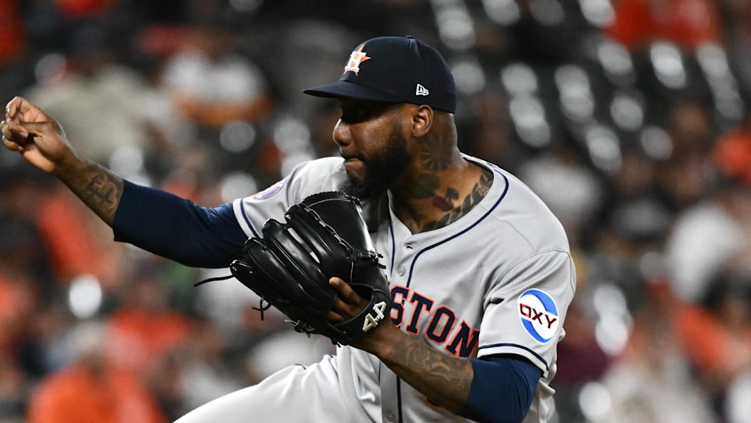 Aug 22, 2025; Baltimore, Maryland, USA;  Houston Astros pitcher Enyel De Los Santos (65) throws a pitch during the seventh inning against the Baltimore Orioles at Oriole Park at Camden Yards. Mandatory Credit: James A. Pittman-Imagn Images