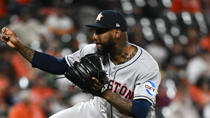 Aug 22, 2025; Baltimore, Maryland, USA;  Houston Astros pitcher Enyel De Los Santos (65) throws a pitch during the seventh inning against the Baltimore Orioles at Oriole Park at Camden Yards. Mandatory Credit: James A. Pittman-Imagn Images