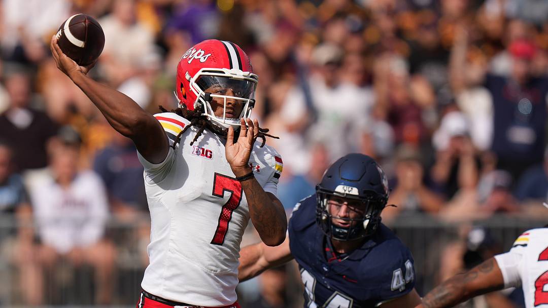 Maryland Terrapins quarterback Malik Washington (7) throws a pass against the UConn Huskies in the first quarter at Rentschler Field. 