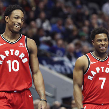 Toronto Raptors guard DeMar DeRozan (10) and guard Kyle Lowry (7) laugh during the first half against the Dallas Mavericks at American Airlines Center. 