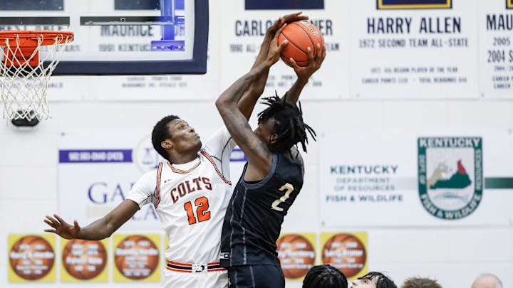 DeSale's Demba Jawo (12) blocks the shot of Little Rock's Chris Washington at Thursday's 2023 Chad Gardner Law King of the Bluegrass holiday basketball tournament at Fairdale High School. Dec. 21, 2023 DeSale's Demba Jawo (12) blocks the shot of Little Rock's Chris Washington at Thursday's 2023 Chad Gardner Law King of the Bluegrass holiday basketball tournament at Fairdale High School. Dec. 21, 2023