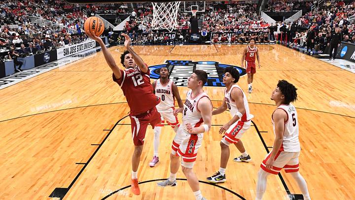 Mar 26, 2026; San Jose, CA, USA; Arkansas Razorbacks forward Malique Ewin (12) shoots past Arizona Wildcats forward Ivan Kharchenkov (8) in the second half during a Sweet Sixteen game of the West Regional of the men's 2026 NCAA Tournament at SAP Center. Mandatory Credit: Eakin Howard-Imagn Images
