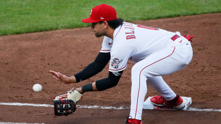 Cincinnati Reds first baseman Alex Blandino (0) catches a put-out throw.