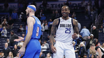 Jan 23, 2025; Oklahoma City, Oklahoma, USA; Dallas Mavericks forward P.J. Washington (25) laughs after a play against Oklahoma City Thunder guard Alex Caruso (9) during the second half at Paycom Center. Mandatory Credit: Alonzo Adams-Imagn Images