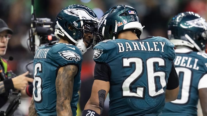 Feb 9, 2025; New Orleans, LA, USA; Philadelphia Eagles wide receiver DeVonta Smith (6) celebrates a touchdown with running back Saquon Barkley (26) against the Kansas City Chiefs during Super Bowl LIX at Ceasars Superdome. Mandatory Credit: Mark J. Rebilas-Imagn Images