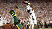 Oct 5, 2024; Ames, Iowa, USA; Iowa State Cyclones defensive back Jontez Williams (3) intercepts a pass intended for Baylor Bears wide receiver Monaray Baldwin (4) at Jack Trice Stadium. Mandatory Credit: Reese Strickland-Imagn Images