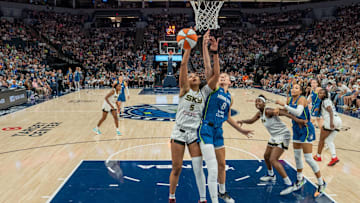 Jul 6, 2025; Minneapolis, Minnesota, USA; Chicago Sky forward Angel Reese (5) and Minnesota Lynx forward Alanna Smith (8) go up for a rebound in the third quarter at Target Center. 