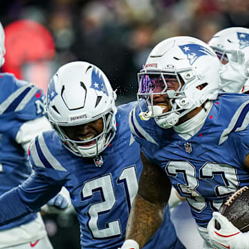 Nov 13, 2025; Foxborough, Massachusetts, USA; New England Patriots linebacker Anfernee Jennings (33) retrieves the ball after a bad snap by the New York Jets in the fourth quarter at Gillette Stadium. Mandatory Credit: David Butler II-Imagn Images