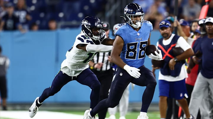 Aug 17, 2024; Nashville, Tennessee, USA; Tennessee Titans tight end David Martin-Robinson (88) is pushed out of bounds by Seattle Seahawks safety Marquise Blair (13) in the fourth quarter at Nissan Stadium. Mandatory Credit: Casey Gower-Imagn Images